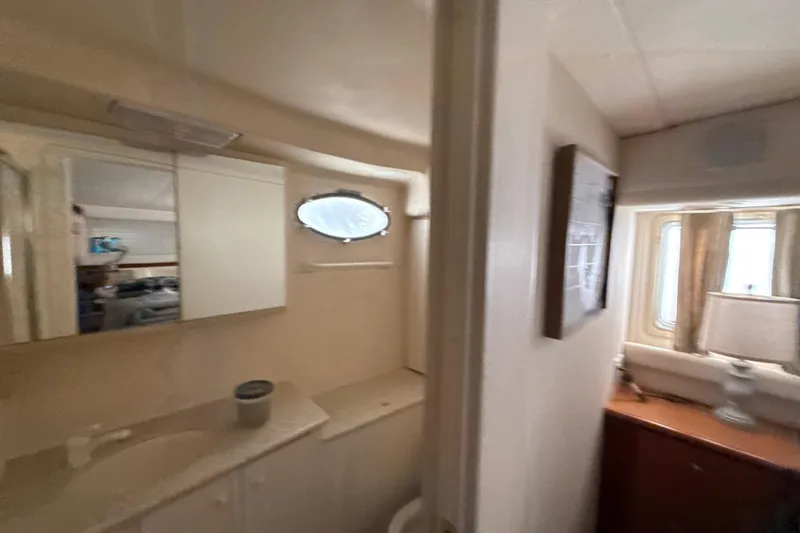 Slide: The Image of Interior of 1999 Silverton 422 Motor Yacht showing bathroom and window area. - 41