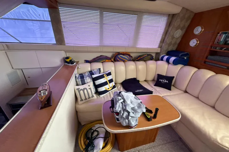 Slide: The Image of Luxurious interior of 1999 Silverton 422 Motor Yacht with plush seating and nautical decor. - 53