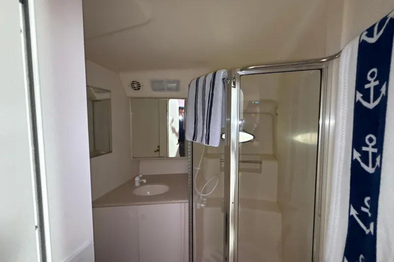 Slide: The Image of Bathroom interior of 1999 Silverton 422 Motor Yacht with shower and sink. - 61