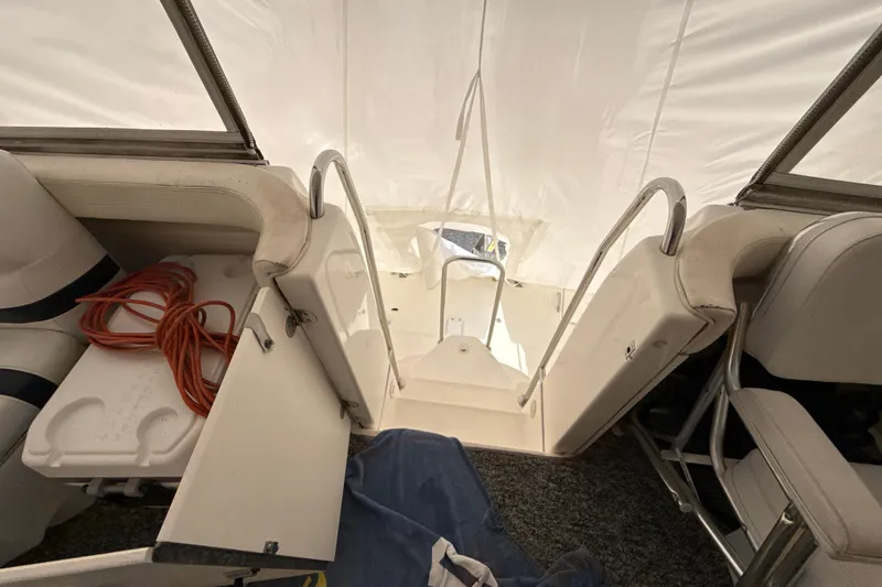 Slide: The Image of Interior view of a 1999 Silverton 422 Motor Yacht with seating and storage. - 68