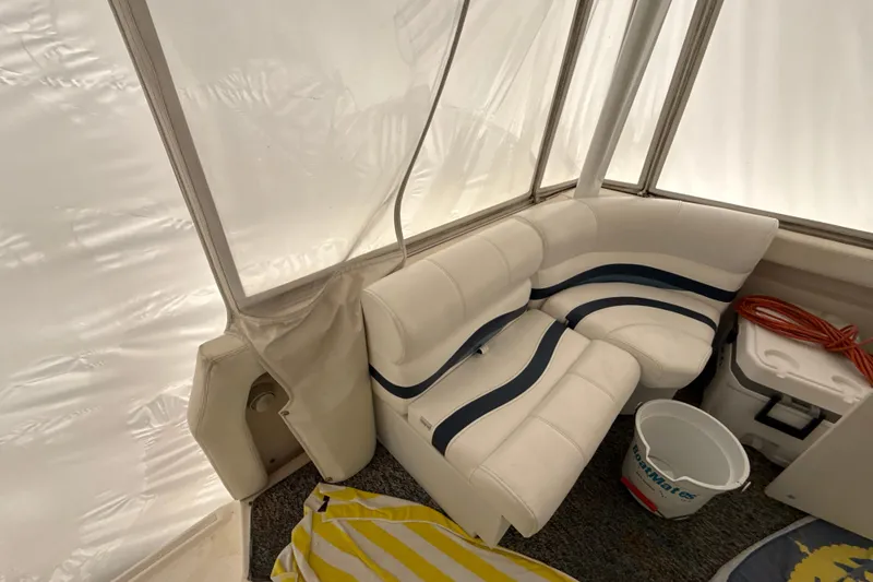 Slide: The Image of Interior of 1999 Silverton 422 Motor Yacht with white seating and nautical decor. - 7