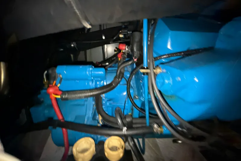 Slide: The Image of Engine compartment of a 1999 Silverton 422 Motor Yacht with visible wiring and components. - 78