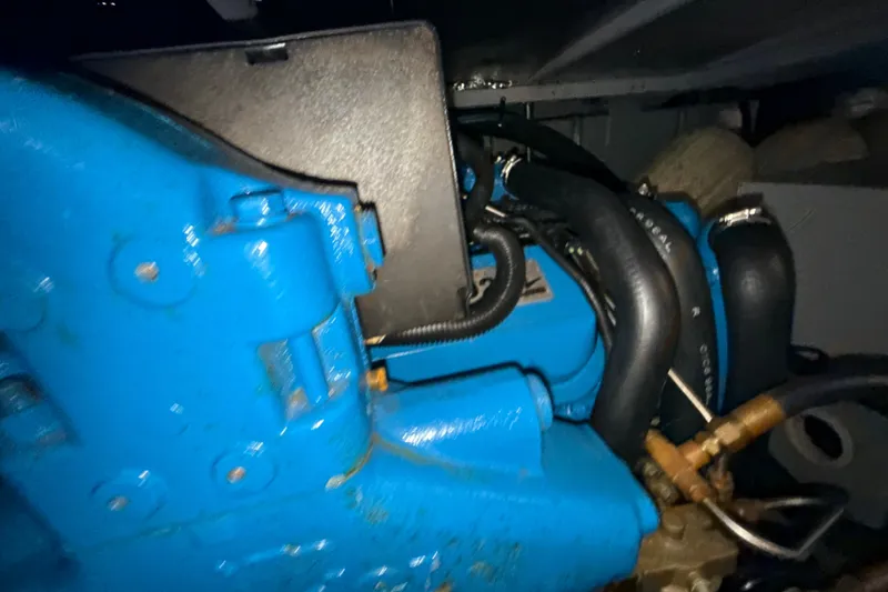 Slide: The Image of Engine compartment of a 1999 Silverton 422 Motor Yacht with blue components. - 81