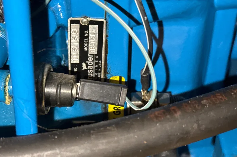 Slide: The Image of Close-up of a Crusader engine component in a 1999 Silverton 422 Motor Yacht. - 84