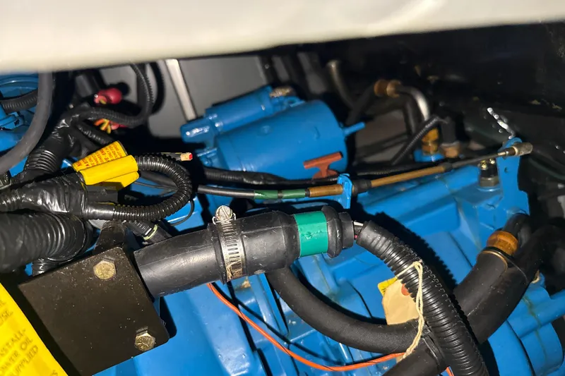 Slide: The Image of Engine compartment of a 1999 Silverton 422 Motor Yacht, showcasing wiring and components. - 85