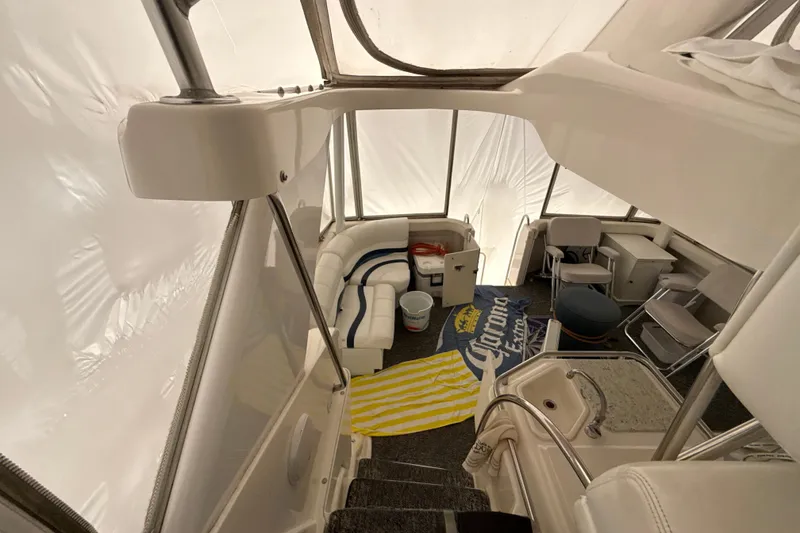 Slide: The Image of Interior of 1999 Silverton 422 Motor Yacht with seating and nautical decor. - 9