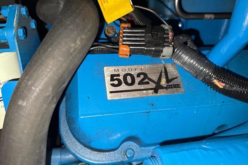 Slide: The Image of Engine compartment of a 1999 Silverton 422 Motor Yacht, featuring Model 502 XL Series. - 90