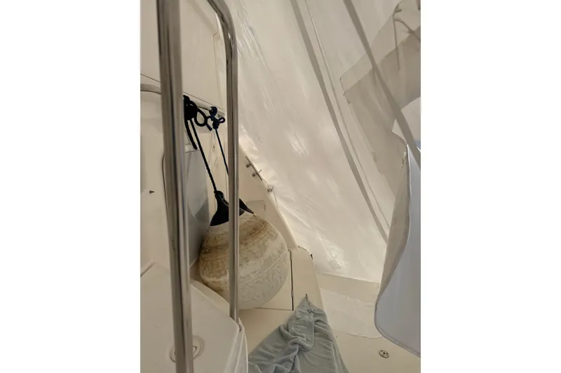 Slide: The Image of Interior view of 1999 Silverton 422 Motor Yacht with hanging fender and railing. - 91