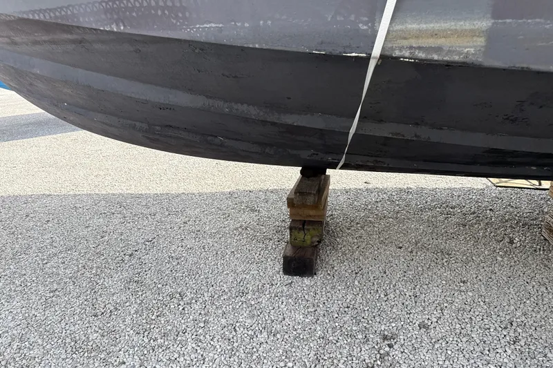 Slide: The Image of Bottom view of a 1999 Silverton 422 Motor Yacht on blocks. - 97