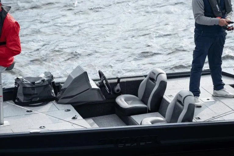 Slide: The Image of Manufacturer Provided Image: 2026 Smoker Craft Viper XR 165 boat interior with two seats on a lake. - 13