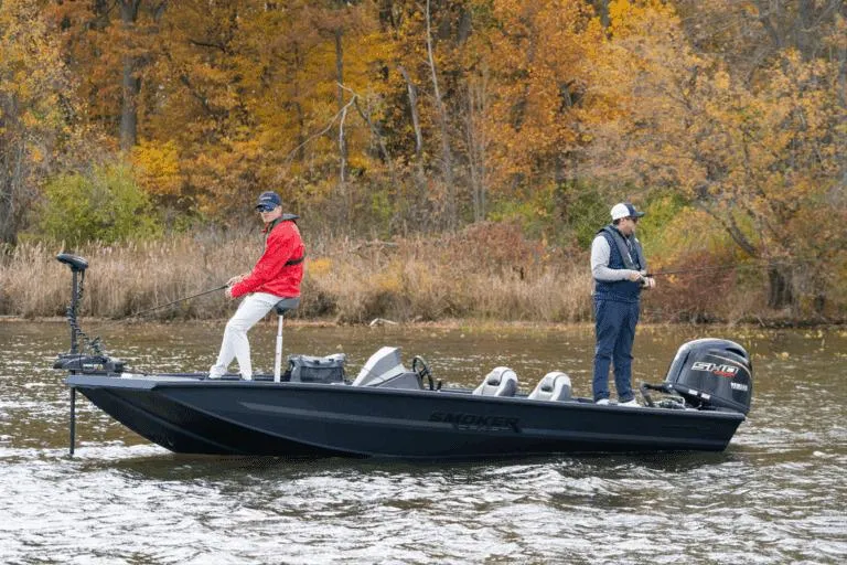 Slide: The Image of Manufacturer Provided Image: 2026 Smoker Craft Viper XR 165 boat on a lake, two people fishing, autumn trees in background. - 7