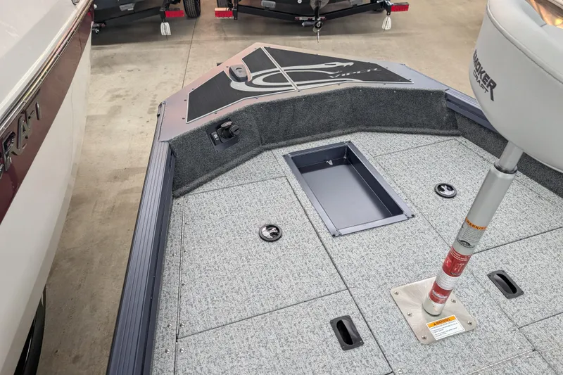 Slide: The Image of 2026 Smoker Craft Viper XR 165 boat interior with storage compartments and seating. - 9