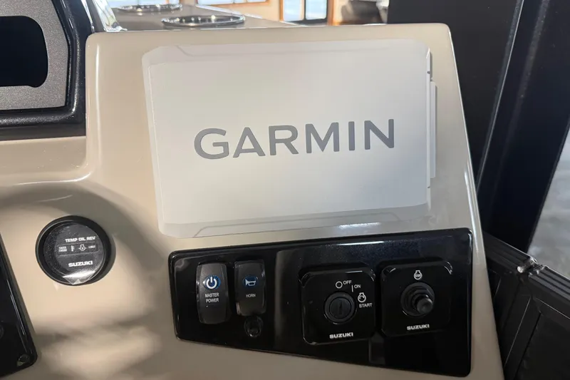 Slide: The Image of Control panel of 2026 Manitou 23 AURORA RF VPII 575 with Garmin display and Suzuki controls. - 10