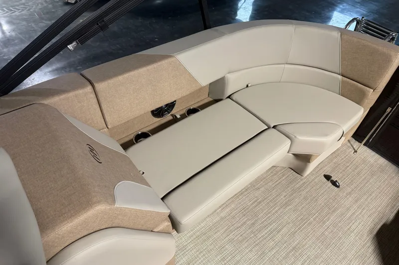 Slide: The Image of Luxurious seating on the 2026 Manitou 23 AURORA RF VPII 575 boat, featuring beige upholstery. - 12