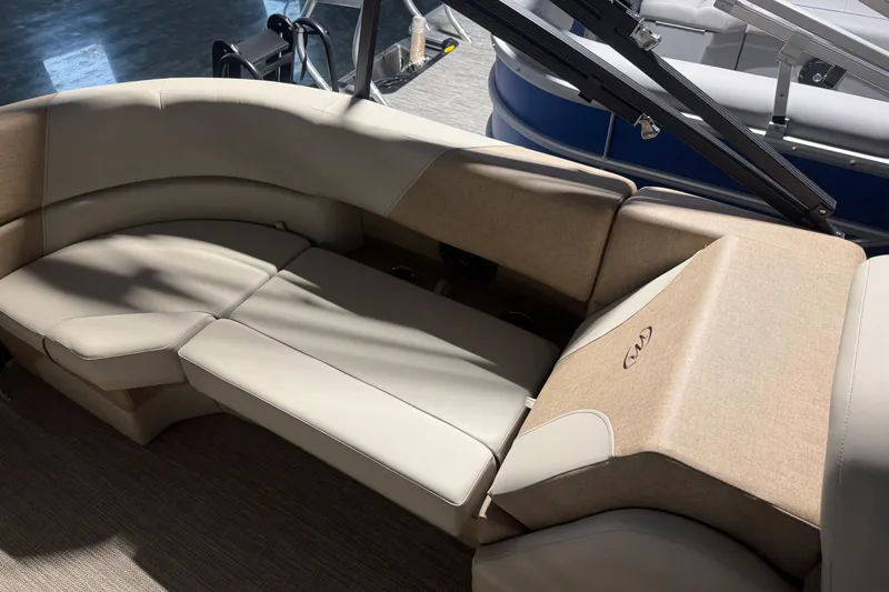 Slide: The Image of Luxurious seating on 2026 Manitou 23 AURORA RF VPII 575 pontoon boat, featuring beige upholstery. - 13