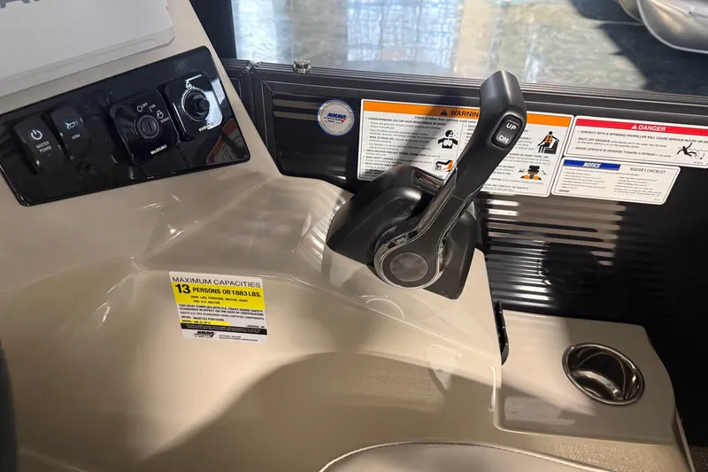Slide: The Image of Control panel of 2026 Manitou 23 AURORA RF VPII 575 boat with capacity label. - 9