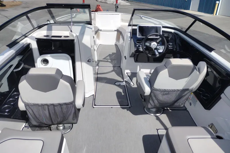 Slide: The Image of 2023 Yamaha AR250 boat interior with modern dashboard and seating arrangement. - 10