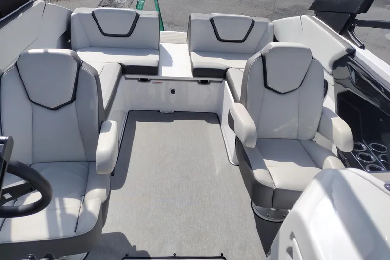 Slide: The Image of 2023 Yamaha AR250 boat interior with modern seating and sleek design. - 14