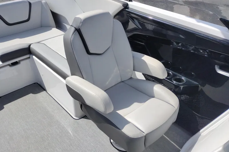 Slide: The Image of 2023 Yamaha AR250 boat interior with sleek gray seating and cup holders. - 15
