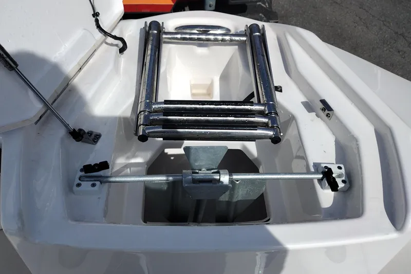 Slide: The Image of 2023 Yamaha AR250 boat anchor compartment with stainless steel ladder. - 30