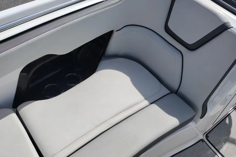 Slide: The Image of 2023 Yamaha AR250 boat interior with cushioned seating and cup holders. - 31