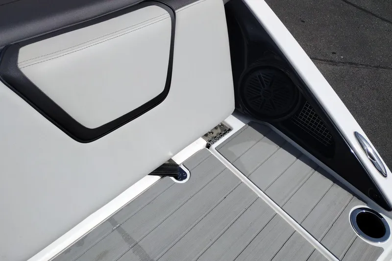 Slide: The Image of 2023 Yamaha AR250 boat interior with speaker and cup holder. - 36