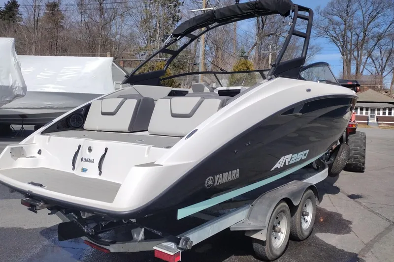 Slide: The Image of 2023 Yamaha AR250 boat on trailer, showcasing sleek design and modern features. - 5