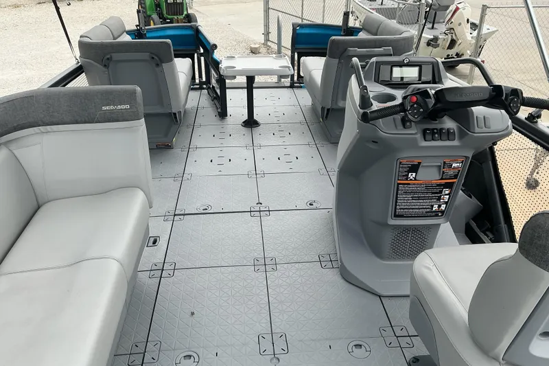 Slide: The Image of 2023 Sea-Doo Switch 19 interior with seating and control console, showcasing modern design. - 12