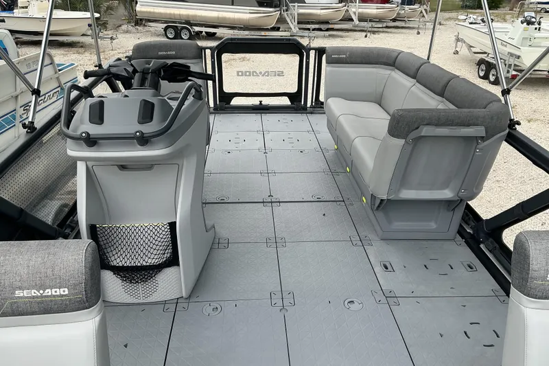Slide: The Image of 2023 Sea-Doo Switch 19 interior with spacious seating and modern helm design. - 6