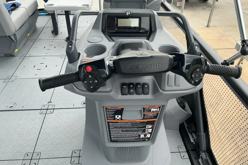 Slide: The Image of 2023 Sea-Doo Switch 19 dashboard with steering controls and display screen. - 8