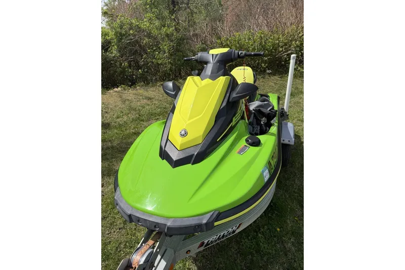 Slide: The Image of 2021 Yamaha WaveRunner EX Sport in vibrant green on grass. - 1
