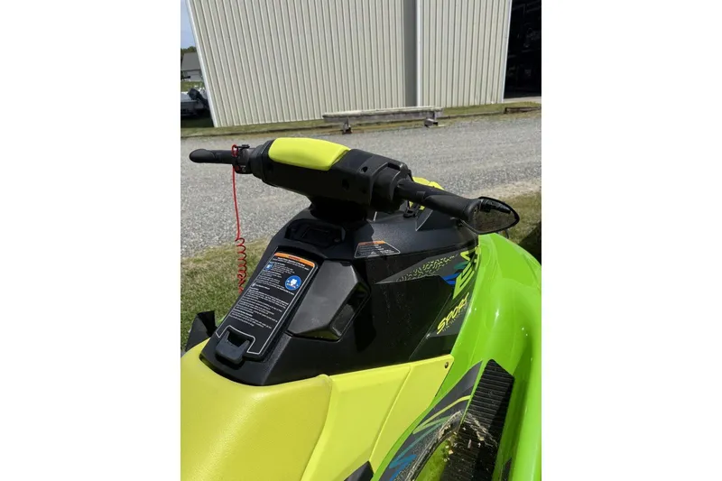 Slide: The Image of 2021 Yamaha WaveRunner EX Sport in vibrant green, parked outdoors. - 4
