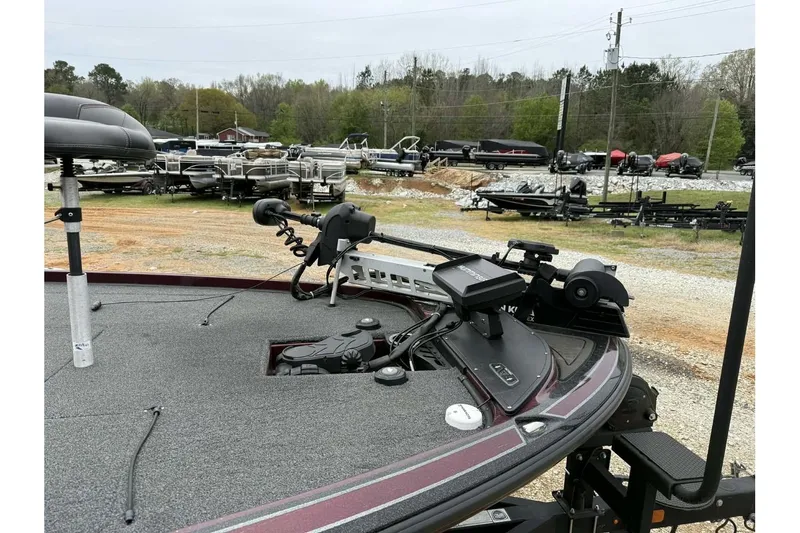 Slide: The Image of 2022 Nitro Z20 Pro boat with advanced fishing equipment, parked outdoors. - 2