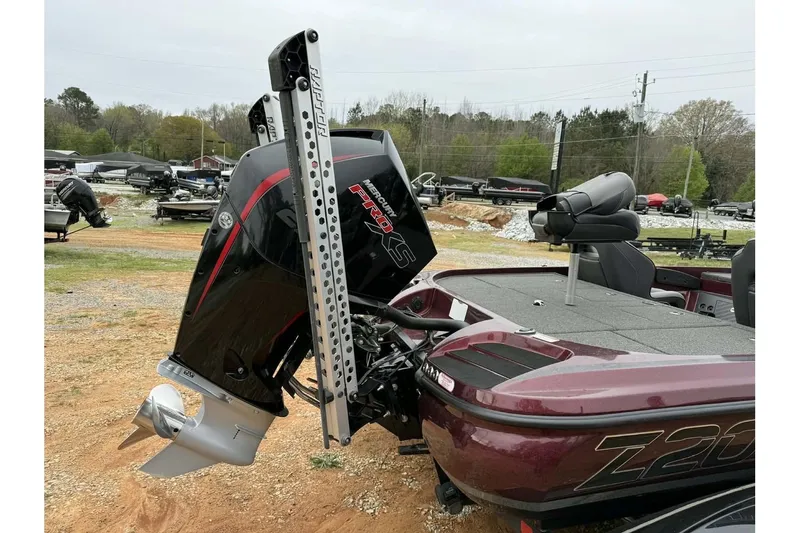 Slide: The Image of Nitro Z20 Pro 2022 boat with powerful outboard motor in a parking area. - 7