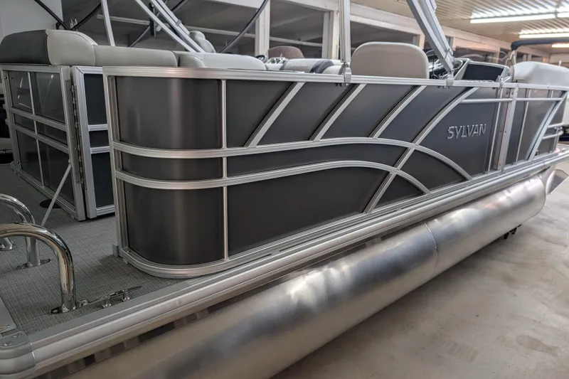 Slide: The Image of 2026 Sylvan Mirage 820 Cruise pontoon boat in a showroom setting. - 1