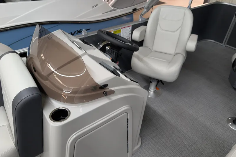 Slide: The Image of Interior of 2026 Sylvan Mirage 820 Cruise boat with modern seating and helm. - 13