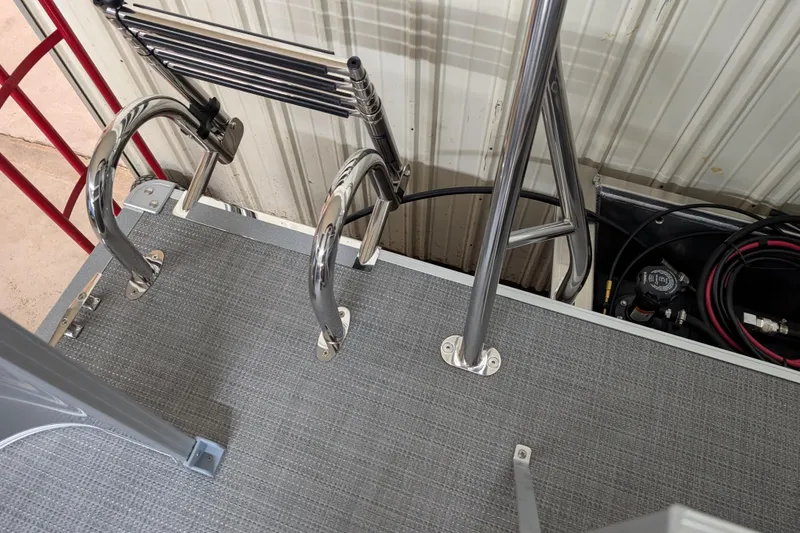 Slide: The Image of 2026 Sylvan Mirage 820 Cruise boat deck with stainless steel ladder and railing. - 7