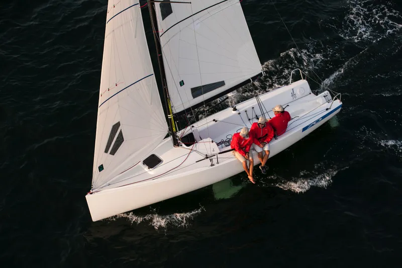 Slide: The Image of Interior view of a 2013 J Boats J/70 sailboat under blue tarp. - 10