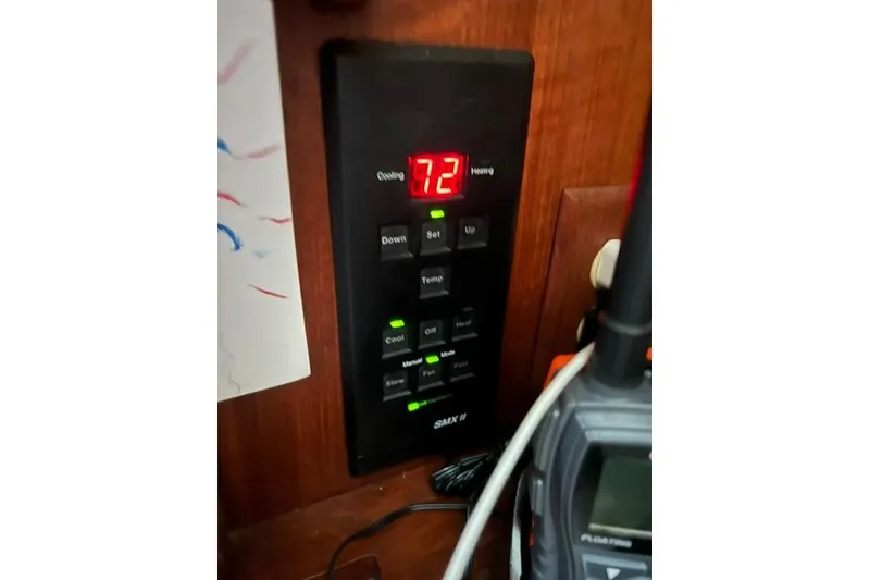 Slide: The Image of Thermostat control panel on a 1990 Hunter 33.5 boat, displaying temperature settings. - 11