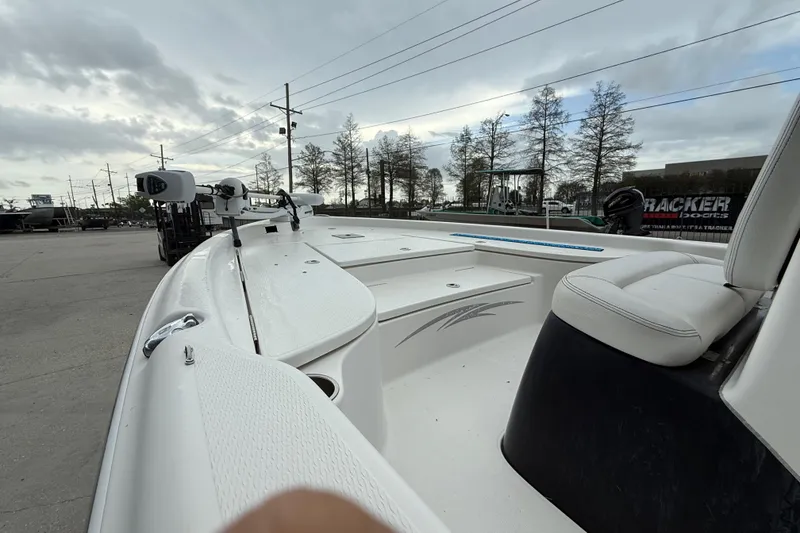 Slide: The Image of 2015 Blue Wave 2000 PureBay boat on a trailer, overcast sky background. - 12