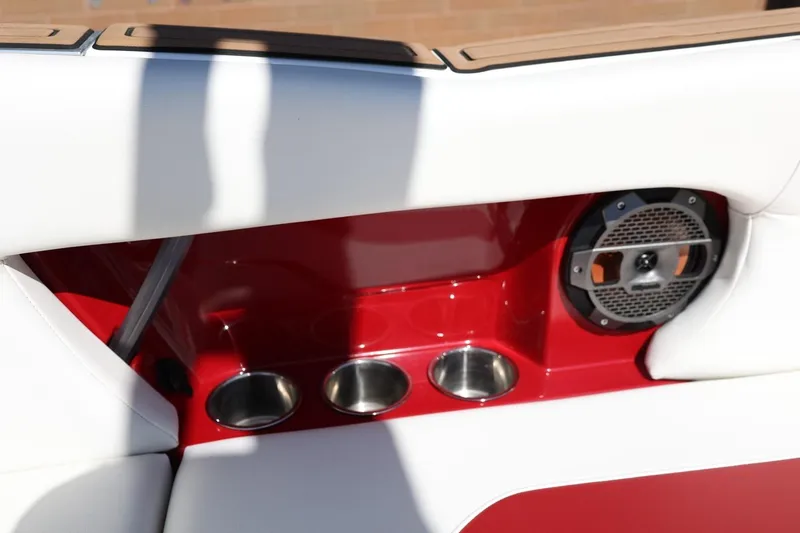 Slide: The Image of Interior of 2021 MasterCraft NXT24 boat with cup holders and speaker. - 35