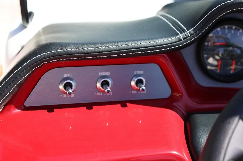 Slide: The Image of Dashboard controls of a 2021 MasterCraft NXT24 boat, featuring blower and bilge switches. - 42