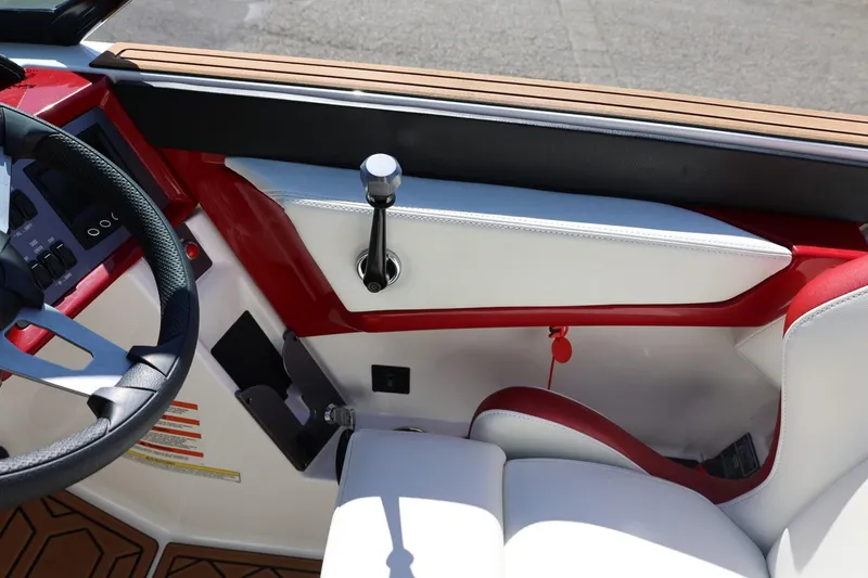 Slide: The Image of Interior of 2021 MasterCraft NXT24 boat with steering wheel and control panel. - 44