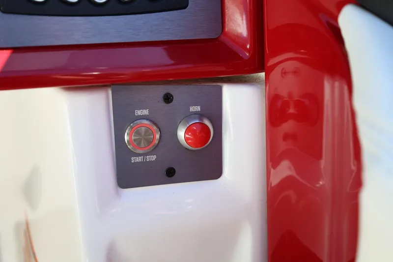 Slide: The Image of Control panel of 2021 MasterCraft NXT24 boat with engine start and horn buttons. - 49