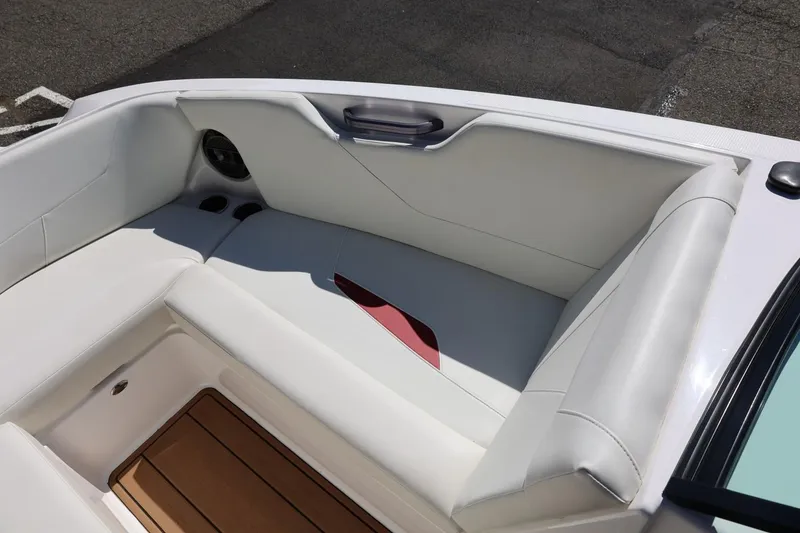 Slide: The Image of Interior seating of a 2021 MasterCraft NXT24 boat with white upholstery. - 52