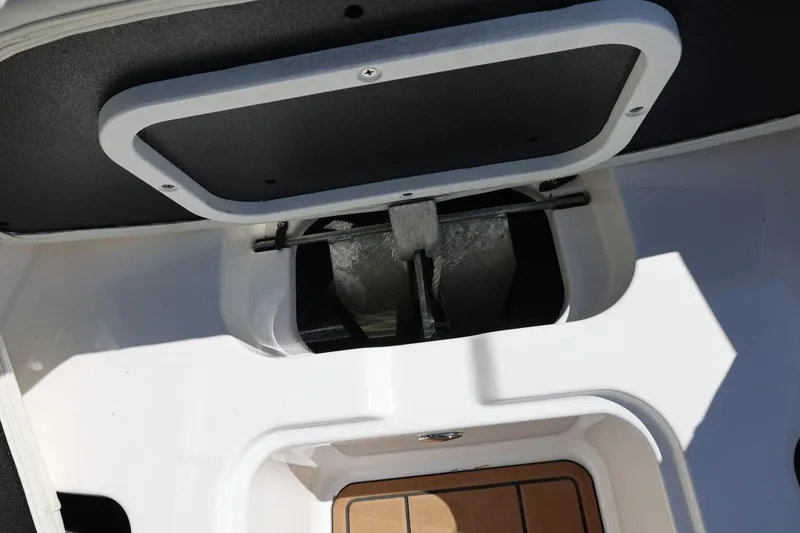 Slide: The Image of 2021 MasterCraft NXT24 boat interior storage compartment with open hatch. - 57