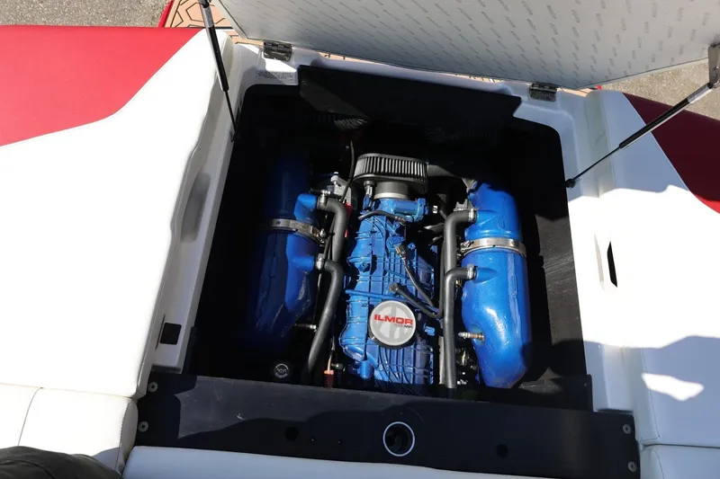 Slide: The Image of 2021 MasterCraft NXT24 boat engine compartment with blue Ilmor engine. - 59