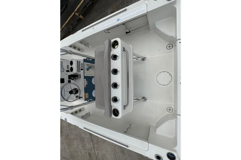 Slide: The Image of 2010 Triton 240 LTS Pro boat interior with steering wheel and control panel. - 12