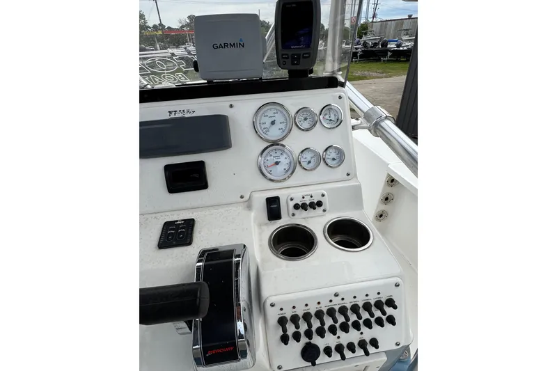 Slide: The Image of Control panel of a 2010 Triton 240 LTS Pro boat with Garmin navigation system. - 15