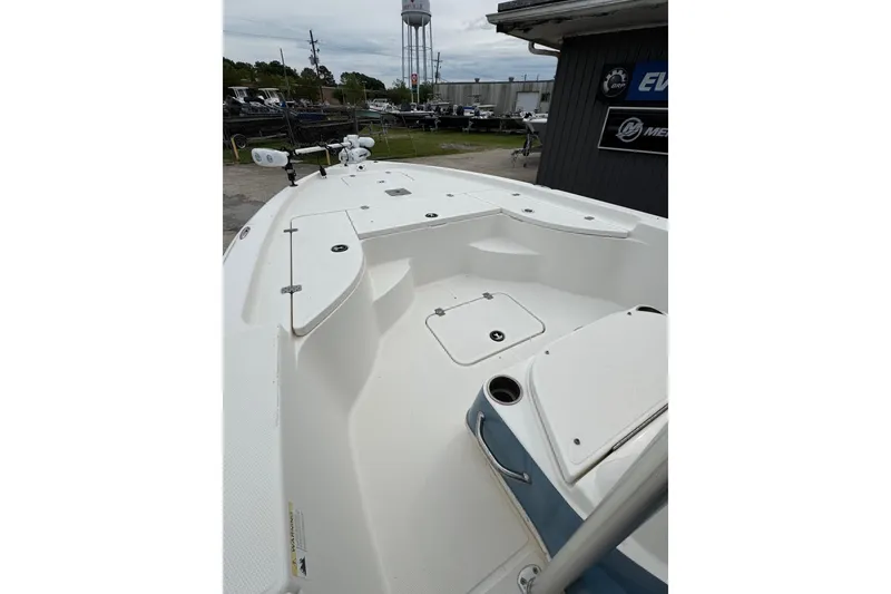 Slide: The Image of 2010 Triton 240 LTS Pro boat deck, featuring spacious storage and sleek design. - 17